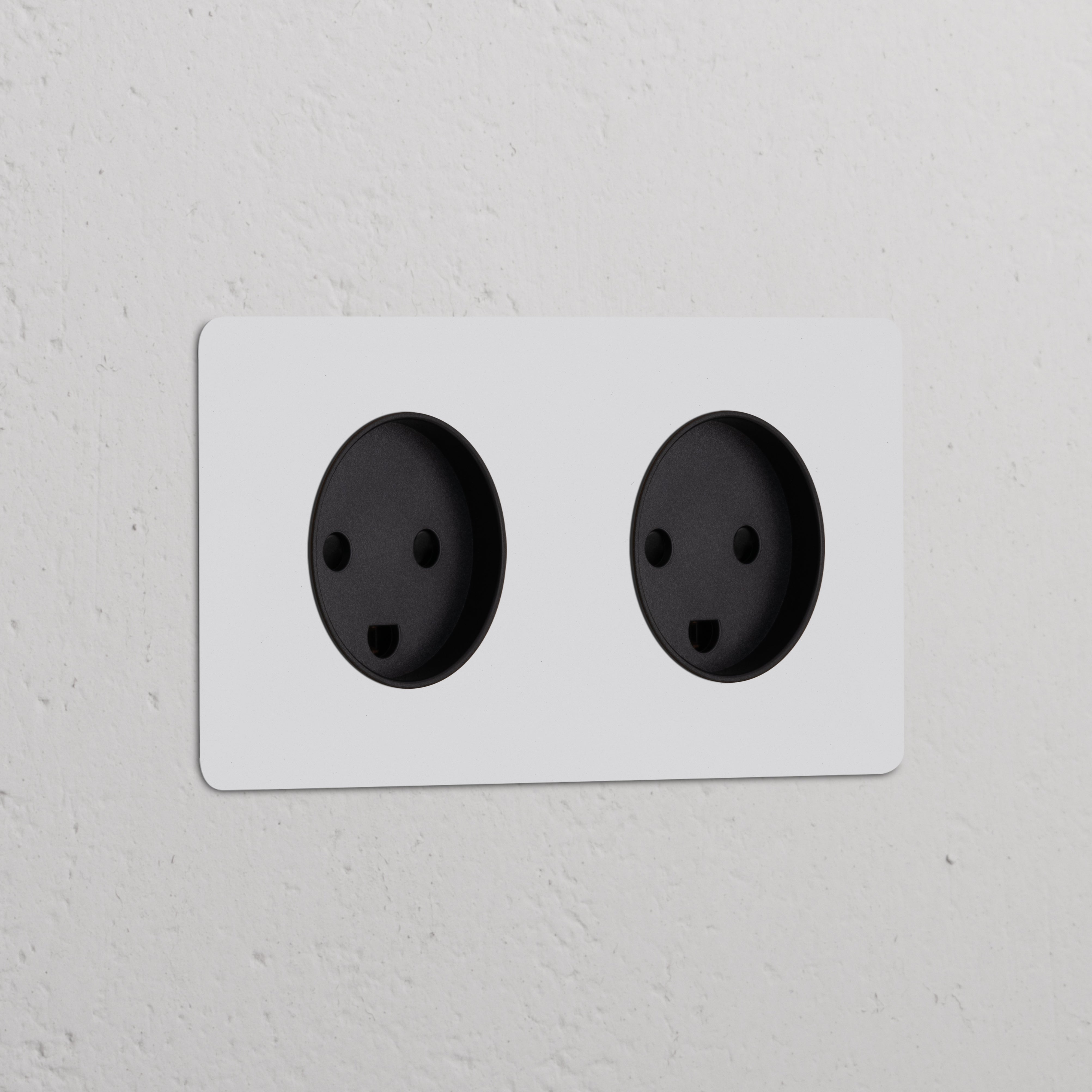 Double 2x Danish Type K power module, paintable black, featuring two round sockets for electrical connectivity.