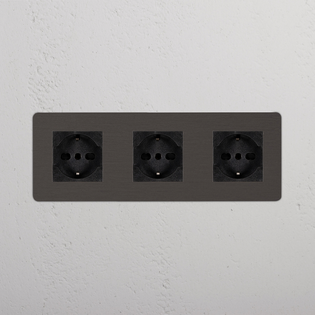 Triple 3x Schuko/Bipasso Module in Bronze Black, featuring three sockets with a refined design.