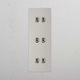 Super Capacity Vertical Light Toggle Switch: Polished Nickel Triple 6x Vertical Toggle Switch on White Background