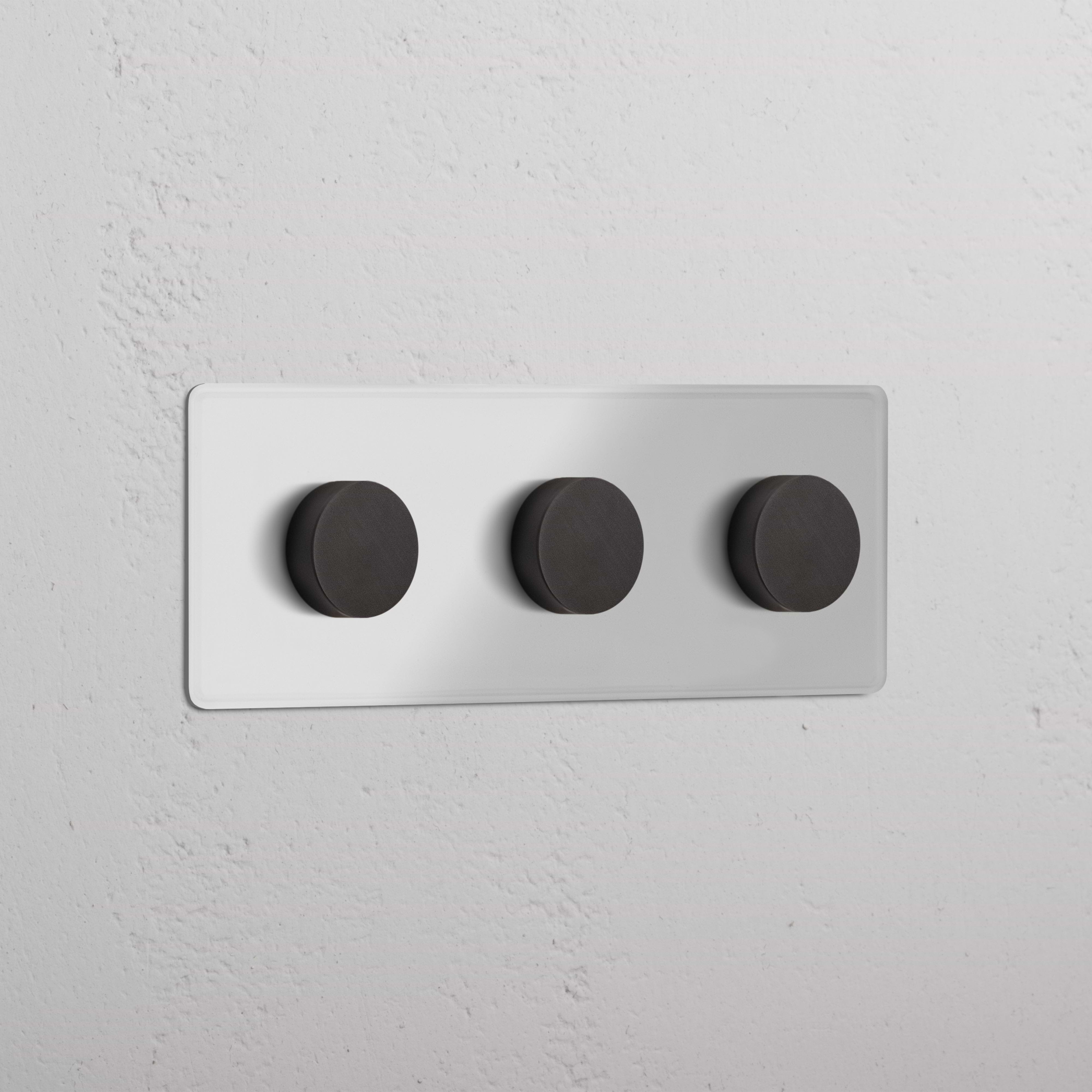 Clear bronze Triple 3x Multiway Dimmer Switch with three round knobs on a wall plate, for lighting control.