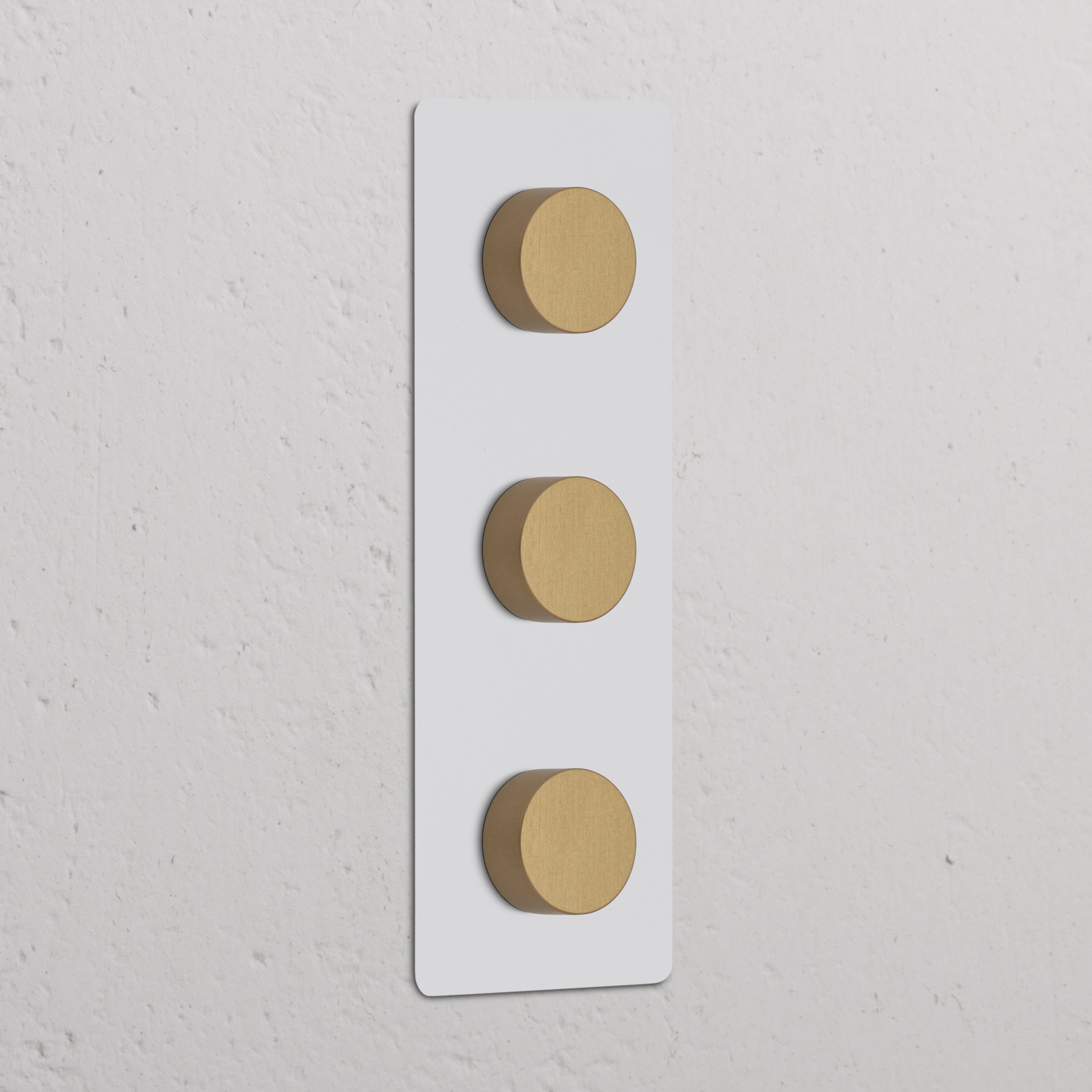 Triple 3x Vertical Dimmer Switch in Paintable Antique Brass finish, featuring three vertical dimmer controls.