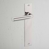 Apsley Long Plate Sprung Door Handle Polished Nickel Finish on White Background at an Angle