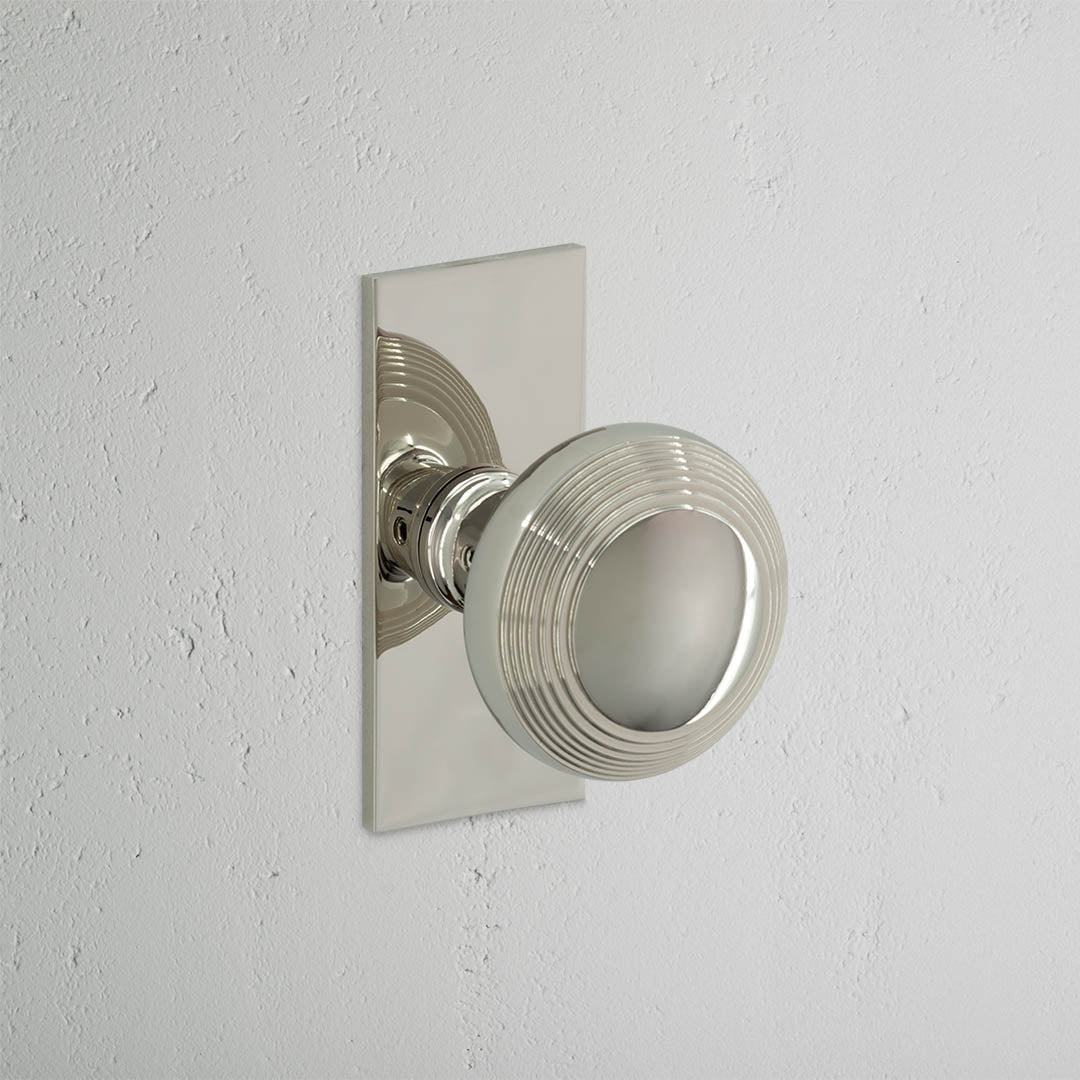 Poplar Short Plate Sprung Door Knob - Polished Nickel