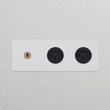 Triple Toggle Switch + 2x Swiss J Power Module in paintable antique brass black finish on a wall.