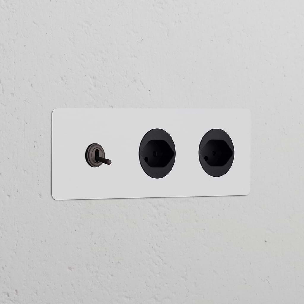 Triple Toggle Switch + 2x Swiss Type J Power Module in paintable bronze black, ideal for modular socket setups.