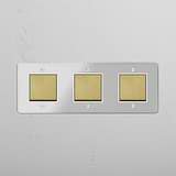 Advanced Light Control System: Triple Rocker Switch in Clear Antique Brass White on White Background
