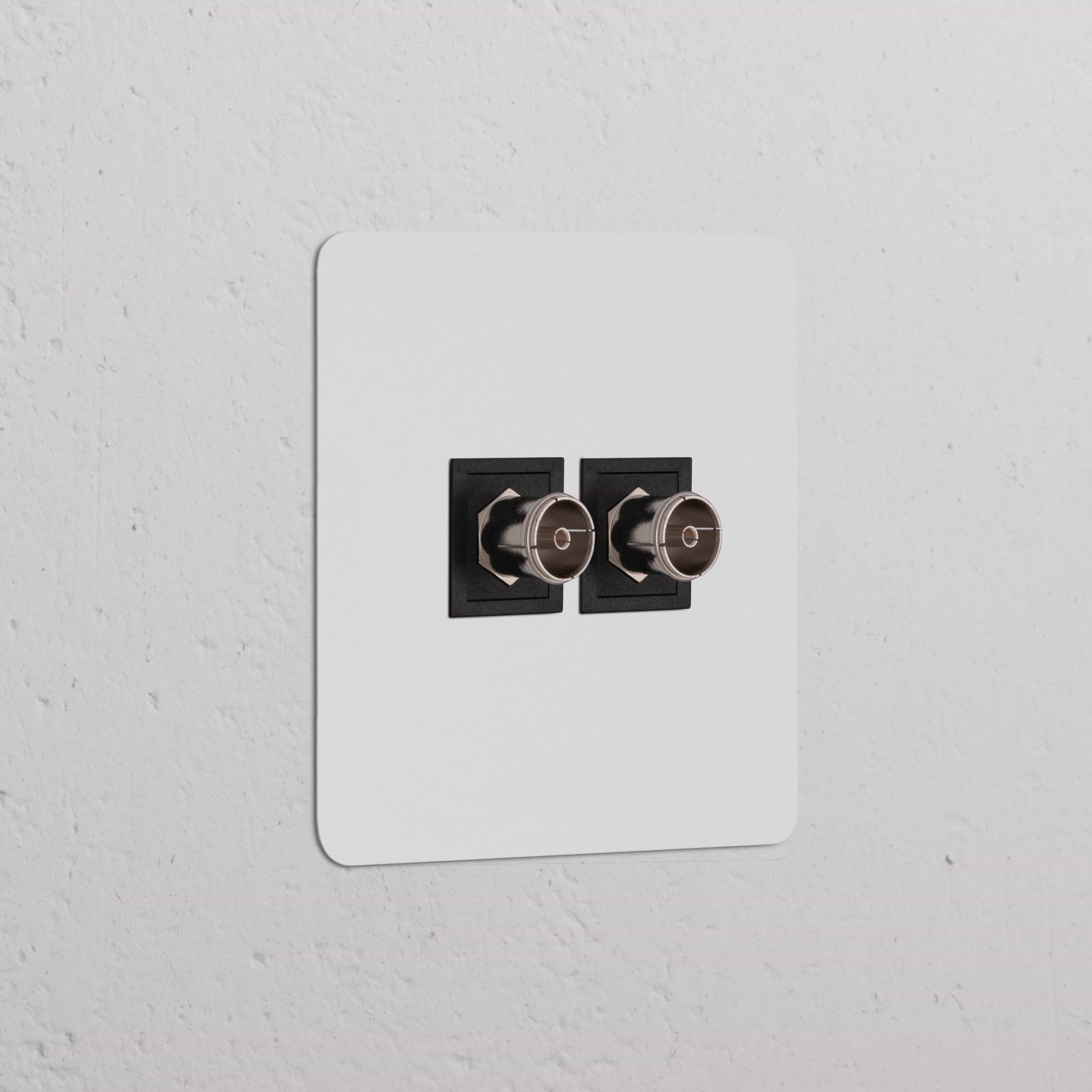 Black paintable Single 2x TV Module, for single sockets; customizable to blend with any décor.