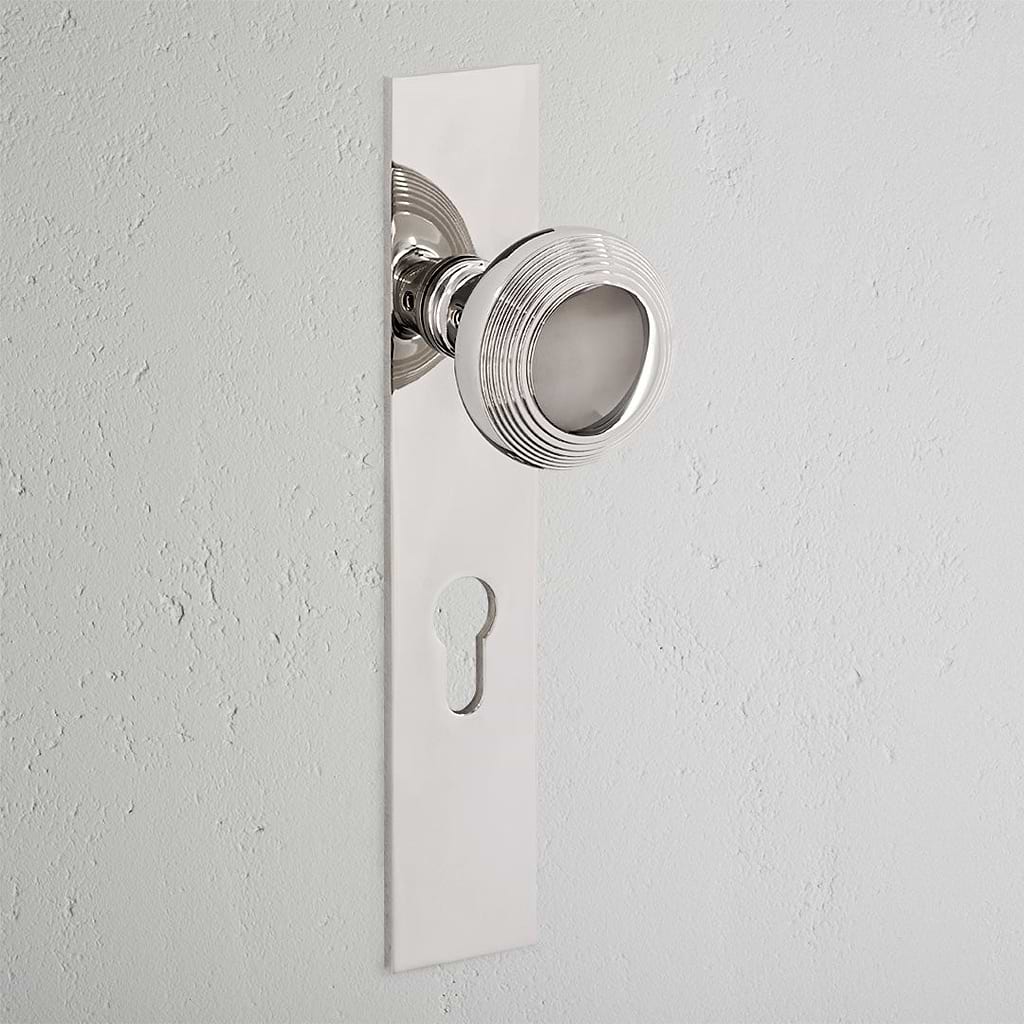 Poplar Long Plate Sprung Door Knob & Euro Lock Polished Nickel Finish on White Background 