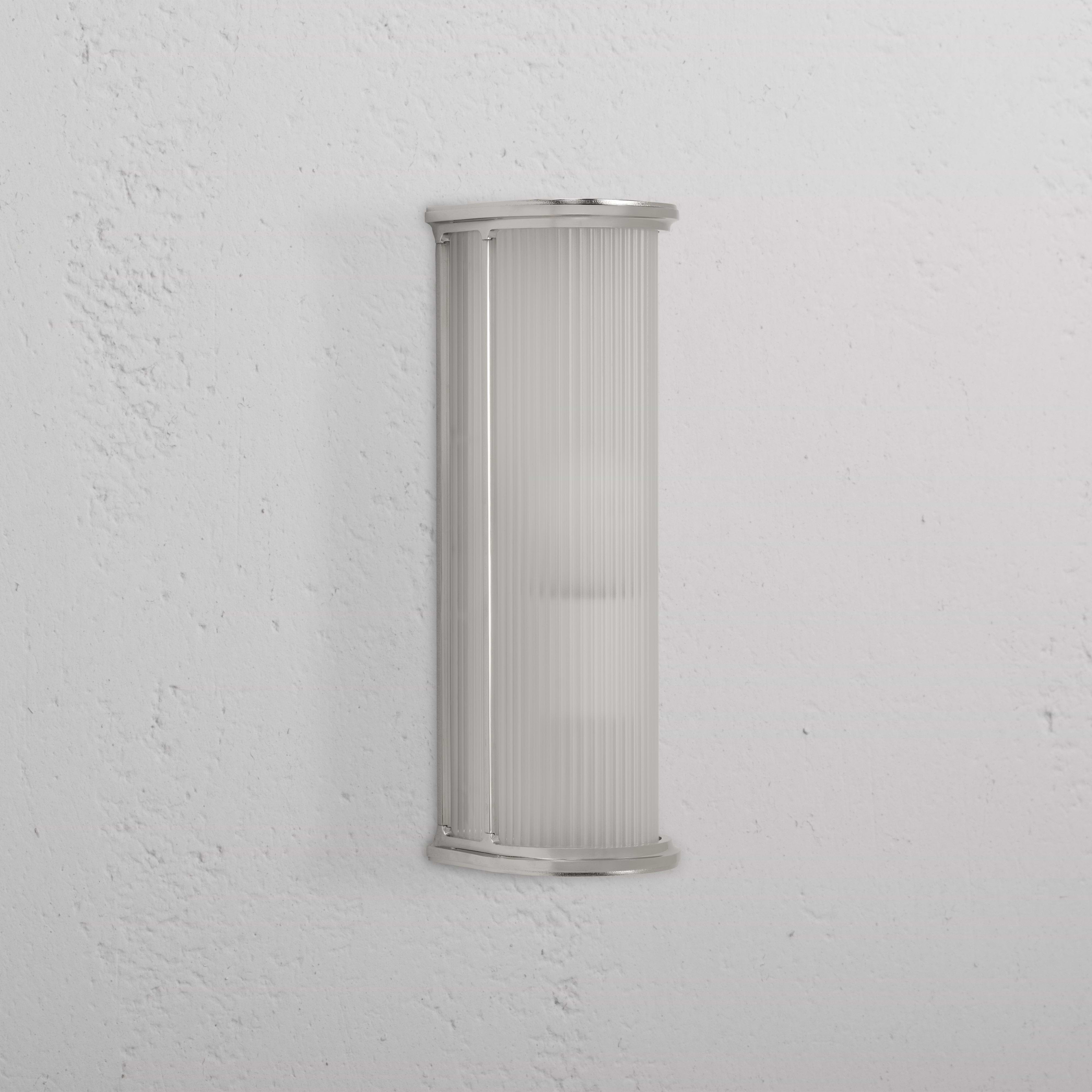 Medium wall light featuring fluted frosted glass and polished nickel trim, mounted on a white wall.