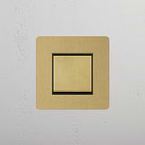 Antique Brass Black Single Rocker Switch with Retractive Function on White Background