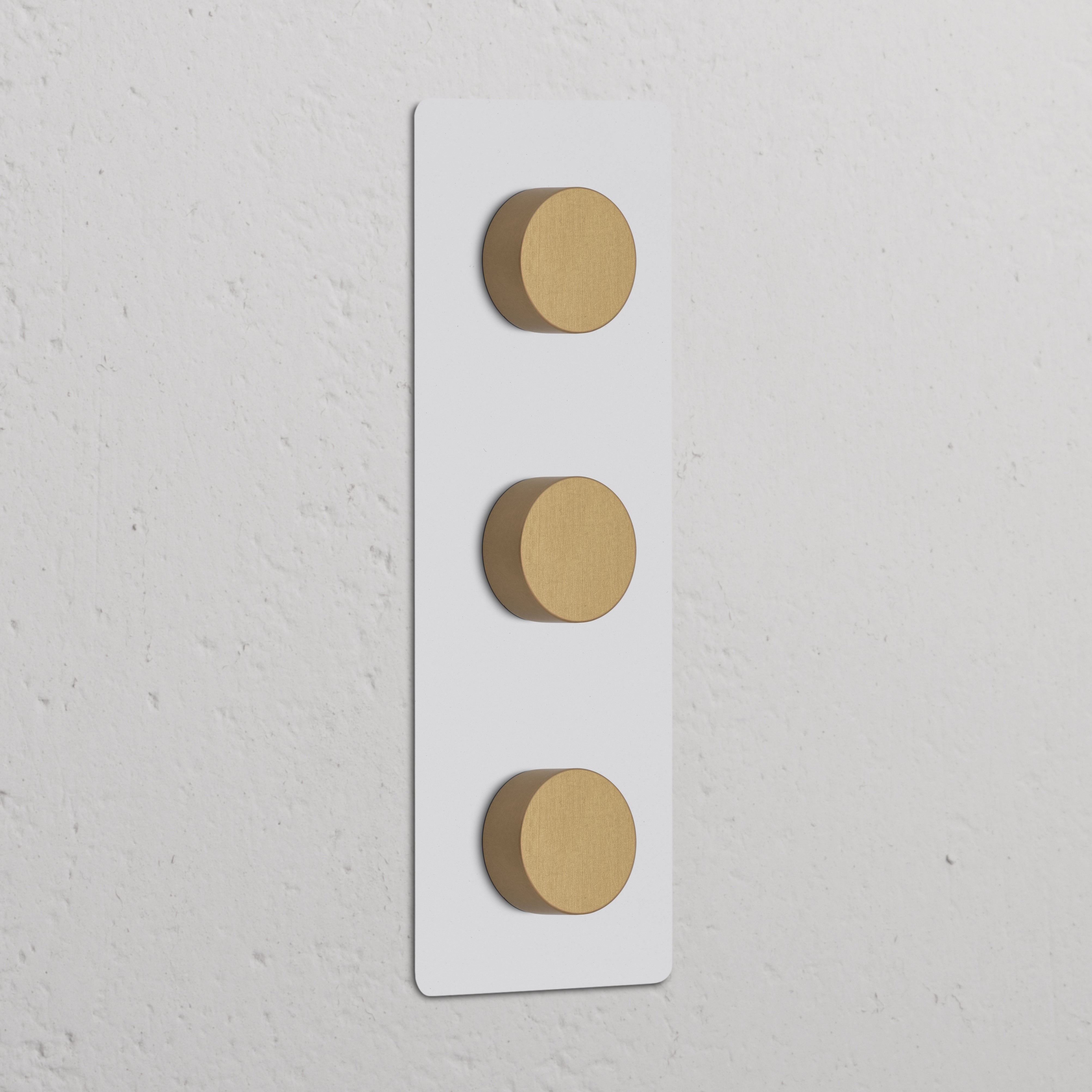 Triple 3x Vertical Multiway Dimmer Switch in paintable antique brass with three round knobs on a wall plate.