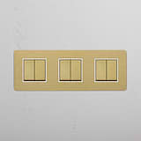 High-Capacity Triple Rocker Switch in Antique Brass White for Modern Living on White Background