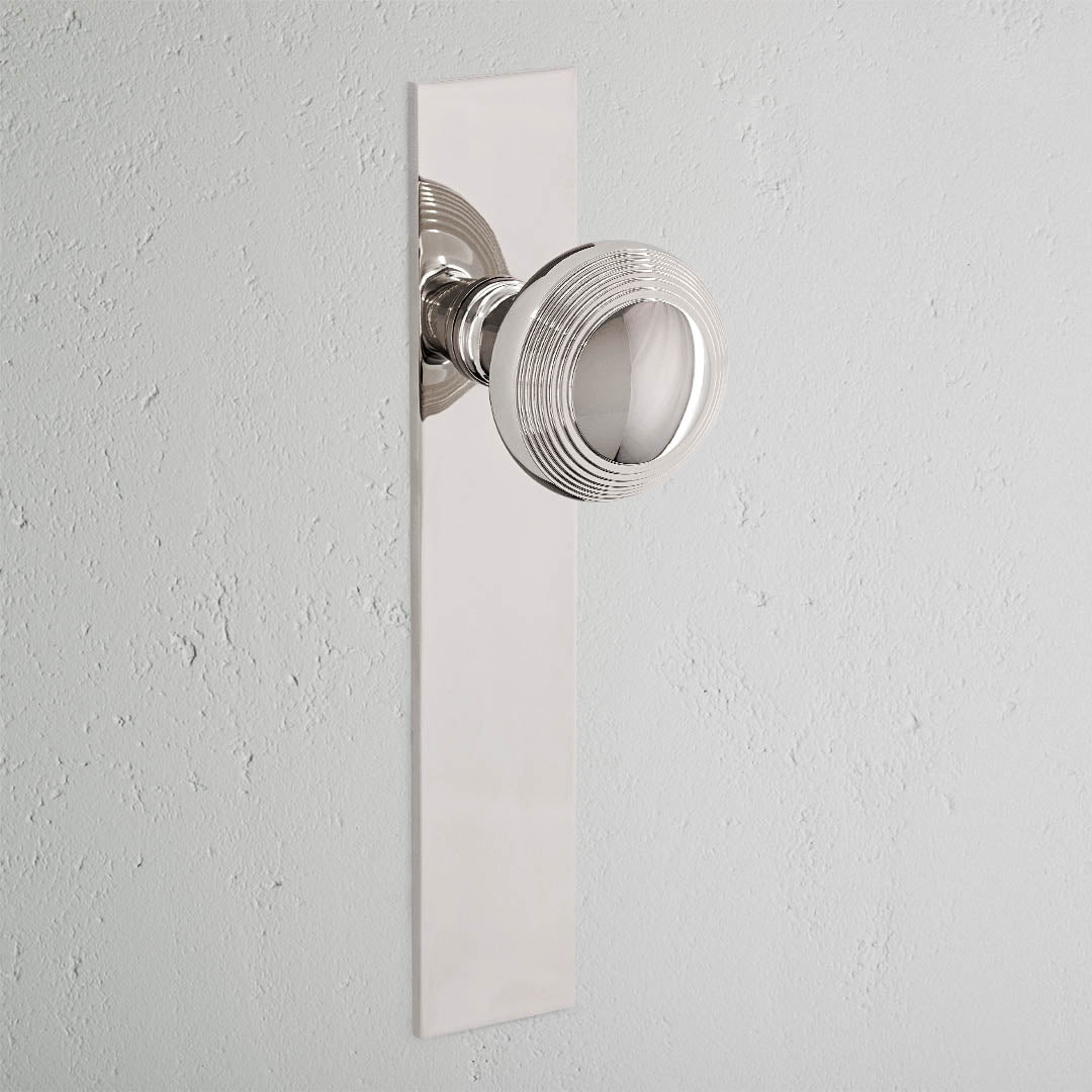 Poplar Long Plate Sprung Door Knob - Polished Nickel
