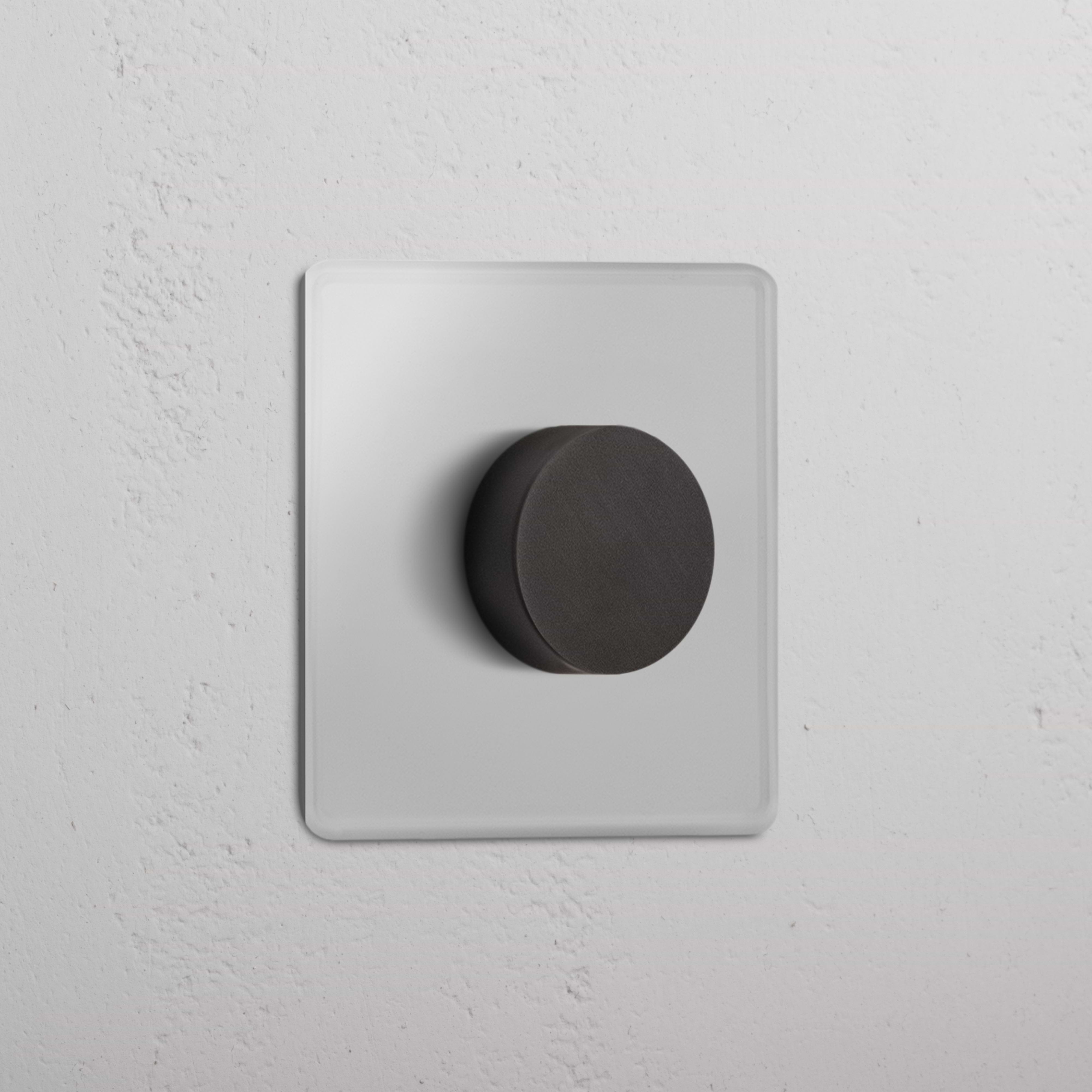 Single Multiway Dimmer Switch – Clear Bronze with a round black knob on a square clear bronze plate.
