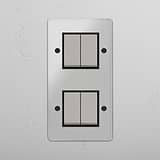 Comprehensive Vertical Four-Position Double Rocker Switch in Clear Polished Nickel Black - Innovative Light Control Tool on White Background