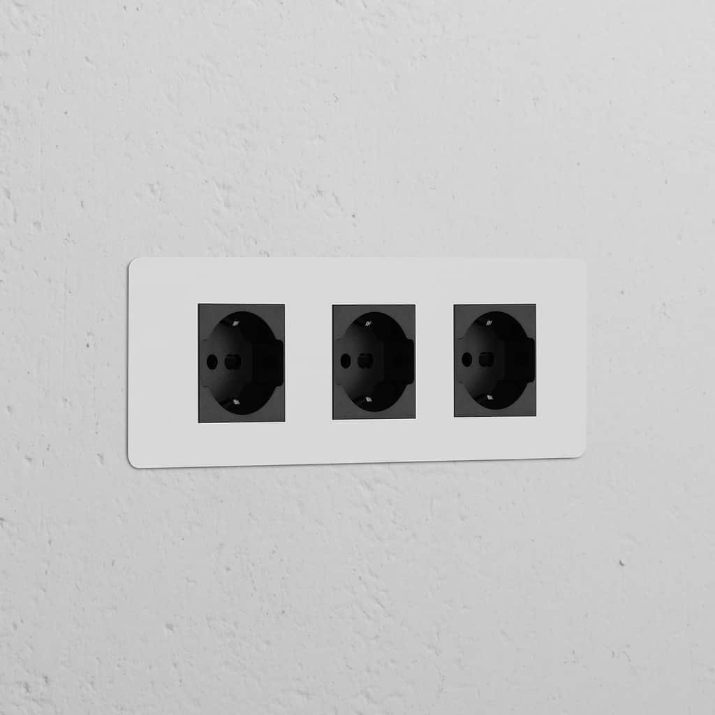 Triple 3x Schuko/Bipasso Power Module with three paintable black sockets integrated into a wall.