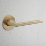 Clayton Flush Rose Fixed Door Handle Antique Brass Finish on White Background 