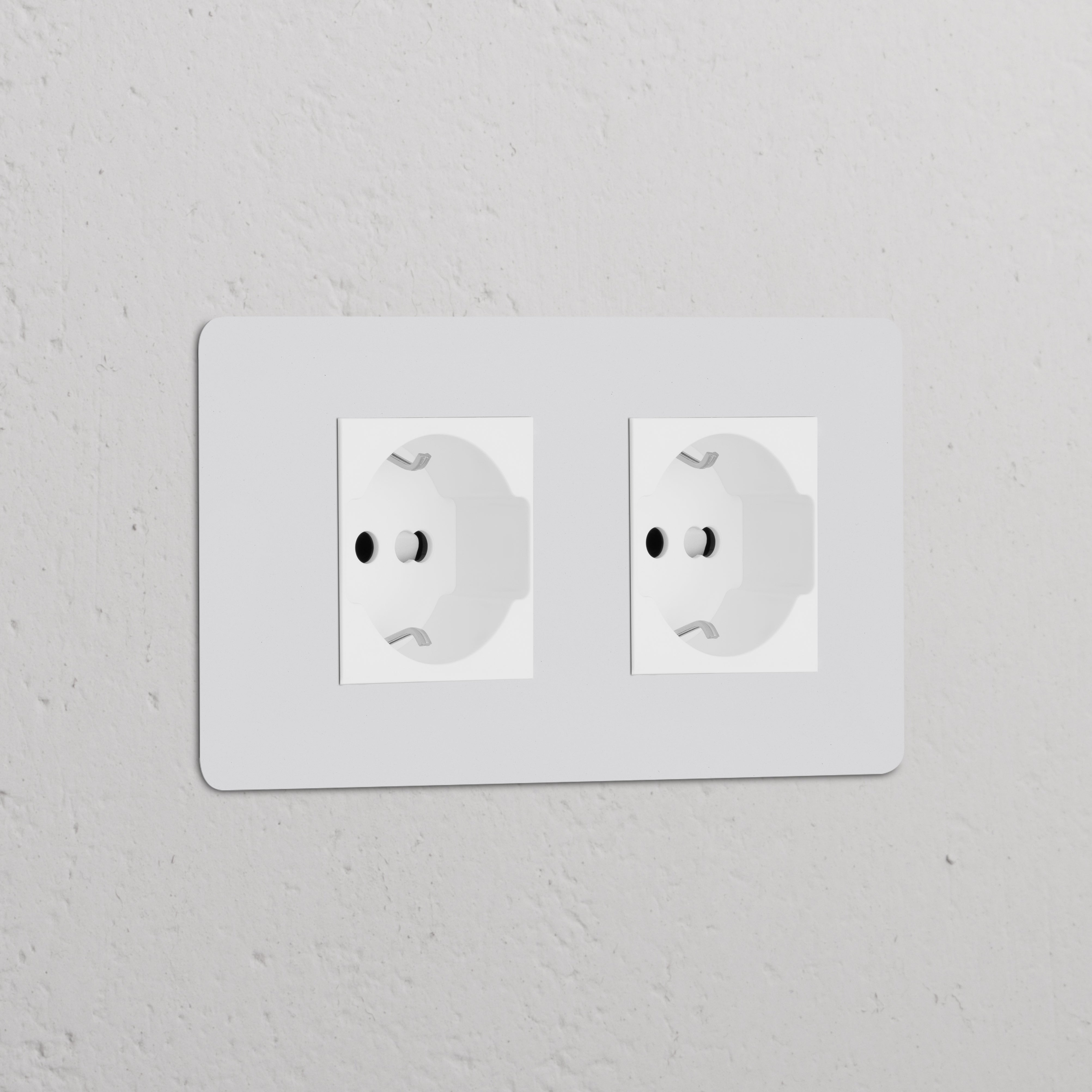 Double Schuko/Bipasso power module; paintable white, designed for double sockets & modules.