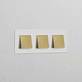 Triple 3x Rocker Switch in white with three square switches, paintable antique brass finish; for Triple Switches & Dimmers.