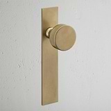 Onslow Long Plate Sprung Door Knob Antique Brass Finish on White Background 