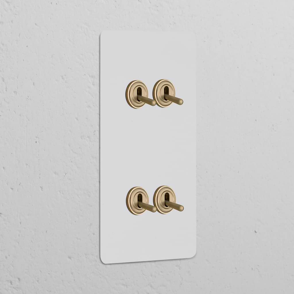 Double 4x vertical toggle switch in paintable antique brass, perfect for classic decor and versatile functionality.