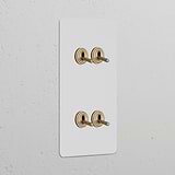 Double 4x vertical toggle switch in paintable antique brass, perfect for classic decor and versatile functionality.