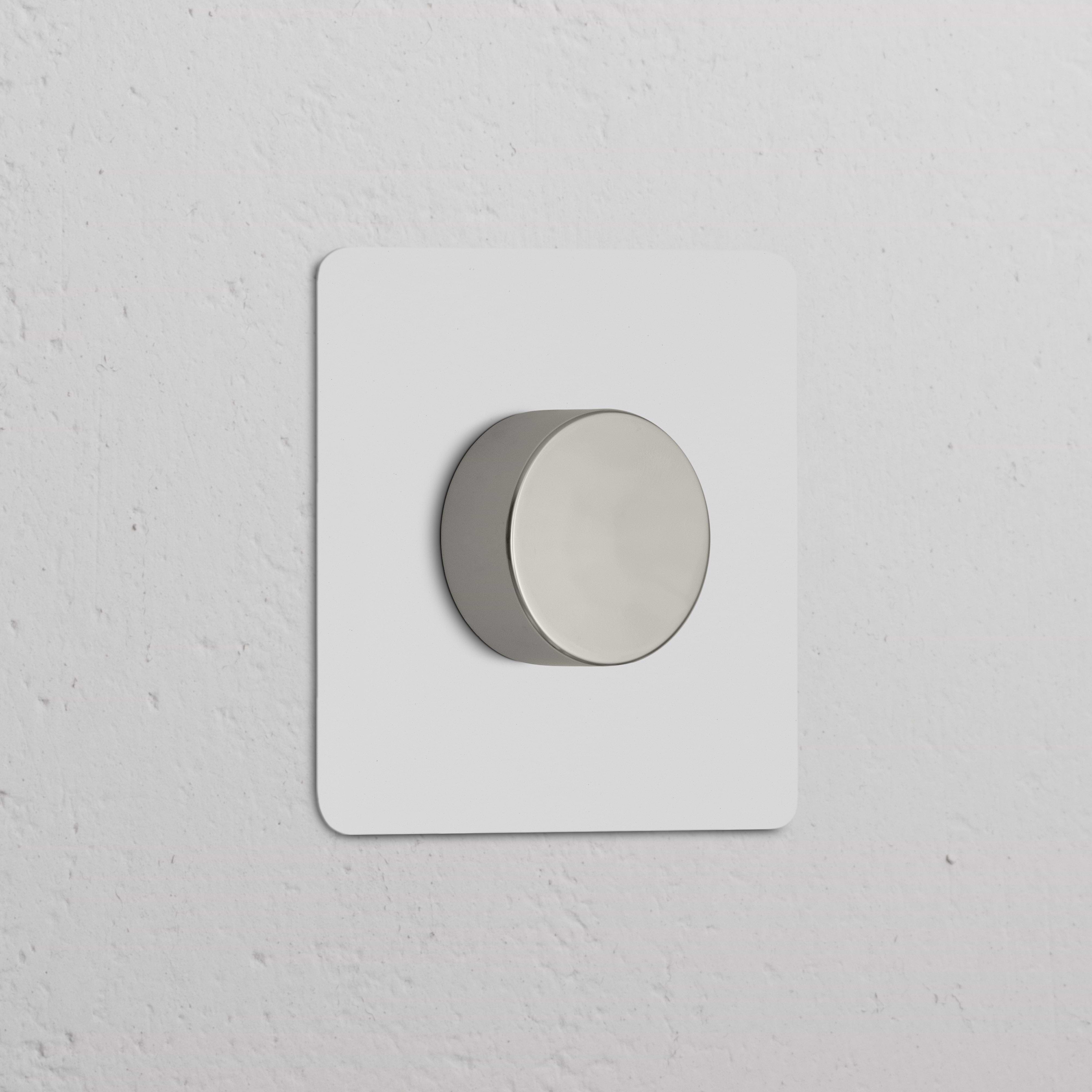 Single Multiway Dimmer Switch in paintable polished nickel finish, mounted on a white square plate.