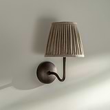 Medium Malvern Wall Light in Natural Beige at an angle affixed to a wall