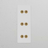 Triple 6x Vertical Toggle Switch in paintable antique brass finish for a vintage look, compatible with vertical switches.