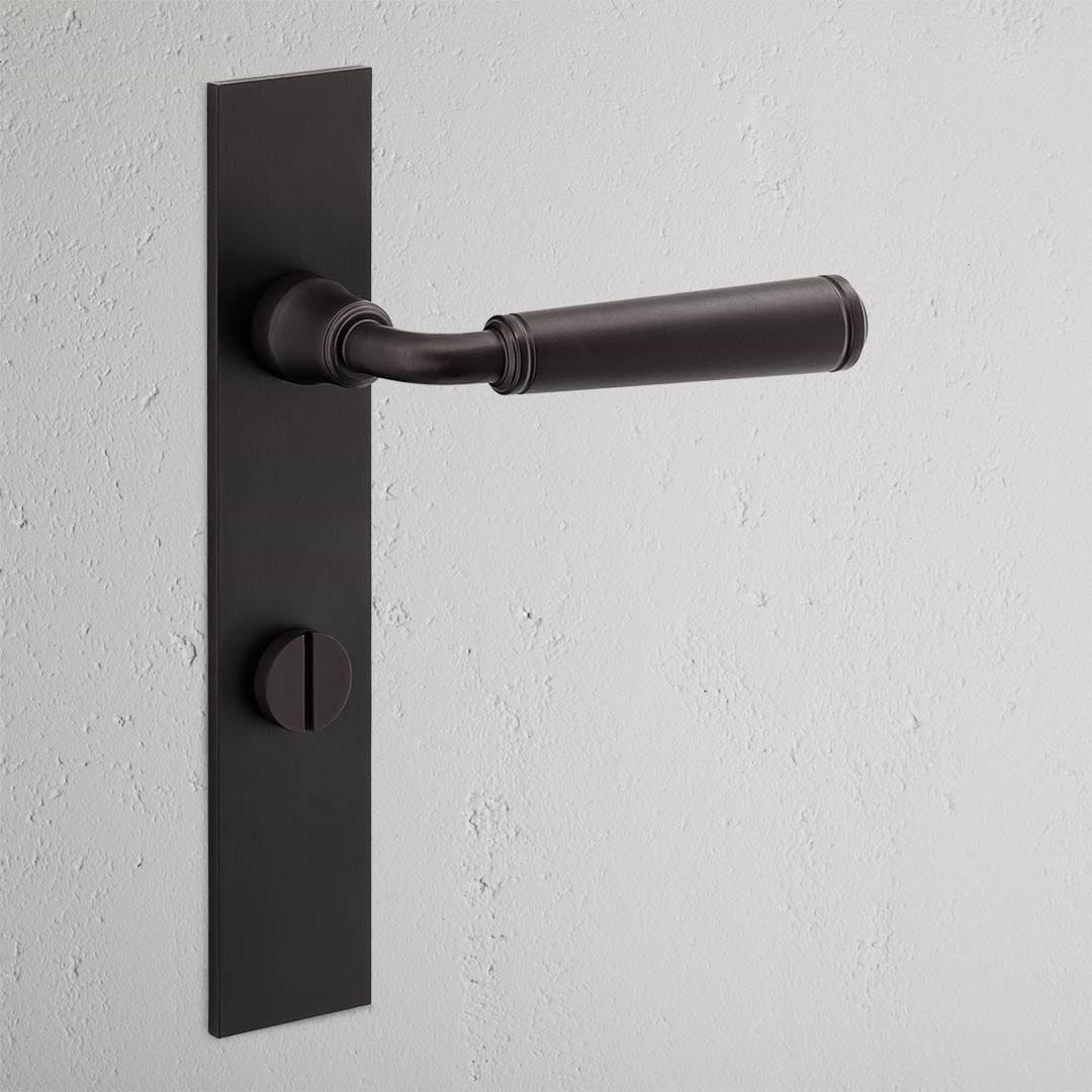 Digby Long Plate Sprung Door Handle & Thumbturn Bronze Finish on White Background