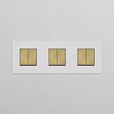Triple 6x rocker switch with paintable antique brass white finish, ideal for coordinating with triple dimmers.