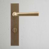 Apsley Long Plate Sprung Door Handle & Thumbturn Antique Brass Finish on White Background Front Facing
