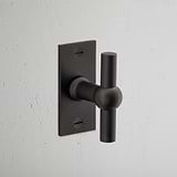 Harper T-Bar Short Plate Sprung Door Handle Bronze Finish on White Background at an Angle