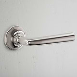 Apsley Sprung Door Handle Polished Nickel Finish on White Background