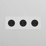 Black, paintable Danish Type K power module with three round sockets for electrical outlet use.