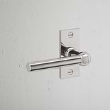 Harper Short Plate Fixed Door Handle Polished Nickel Finish on White Background at an Angle