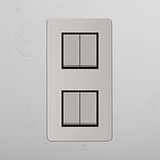 High Capacity Vertical Light Control Switch on White Background: Polished Nickel Black Double 4x Vertical Rocker Switch