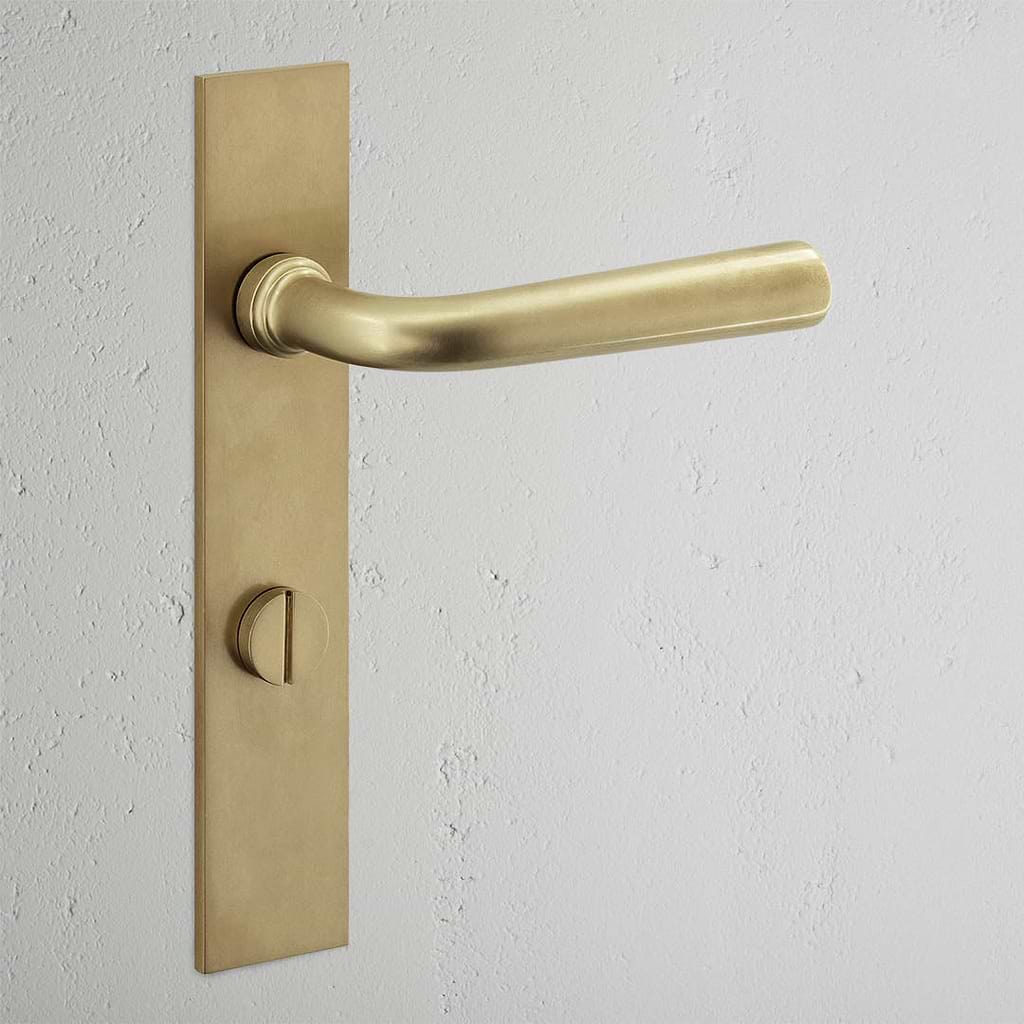 Apsley Long Plate Sprung Door Handle & Thumbturn Antique Brass Finish on White Background 