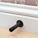 Bronze Montpelier Door Stop on White Wall Trim