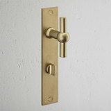Harper T-Bar Long Plate Sprung Door Handle & Thumbturn Antique Brass Finish on White Background at an Angle