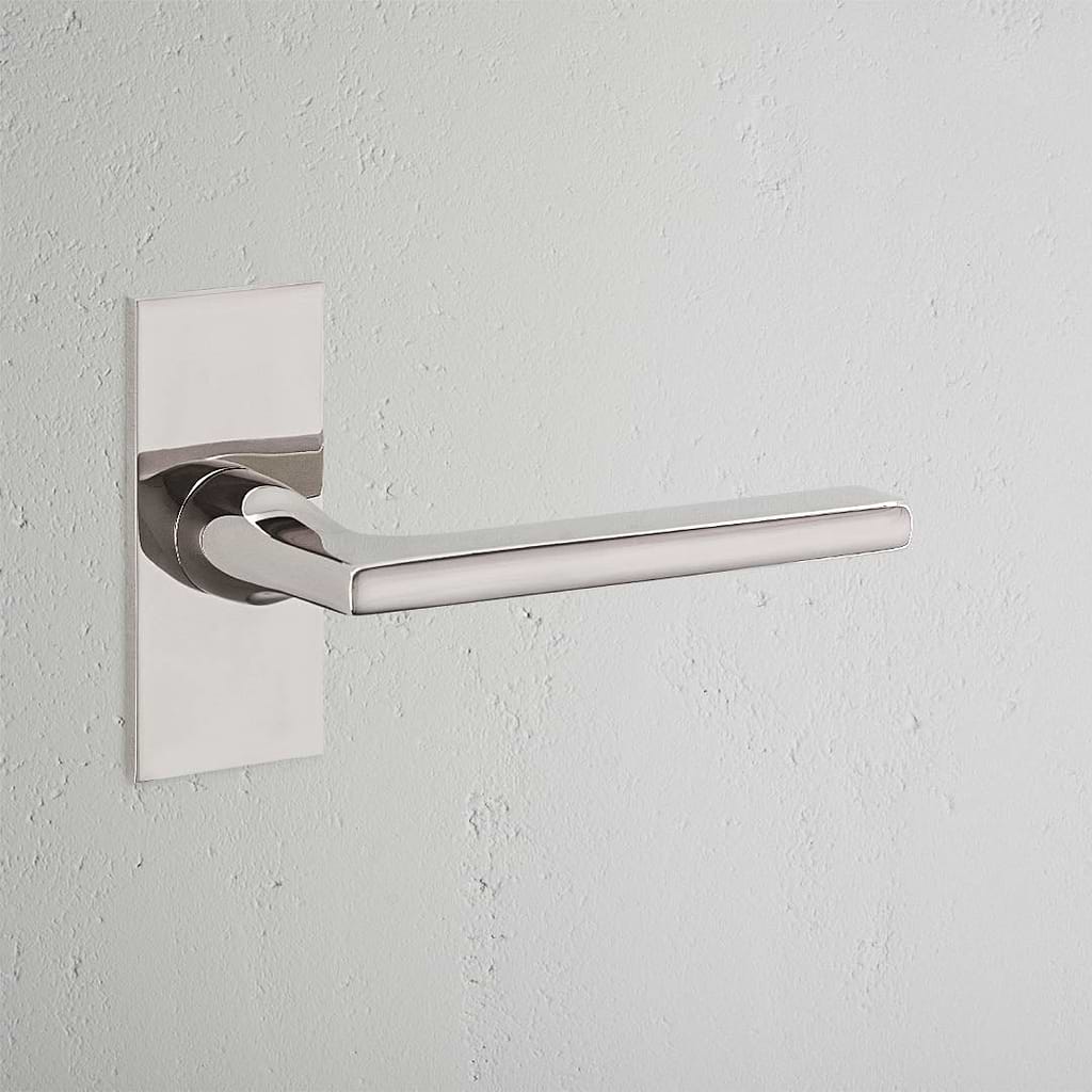 Clayton Short Plate Fixed Door Handle Polished Nickel Finish on White Background  