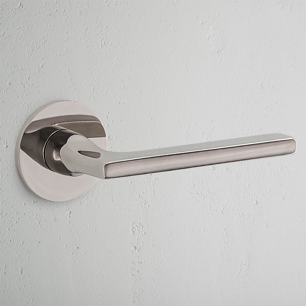 Clayton Sprung Door Handle With Flush Rose - Polished Nickel