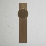 Onslow Long Plate Sprung Door Knob Antique Brass Finish on White Background Front Facing