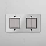 Comprehensive Four-Position Double Rocker Switch in Clear Polished Nickel Black for Light Management on White Background