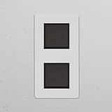 Double 2x vertical rocker switch in paintable bronze black, part of the Double Vertical Switches & Dimmers line.