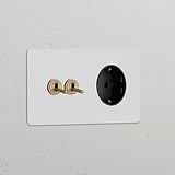 Antique brass wall plate with two toggle switches and a Schuko Type F power module, paintable finish.