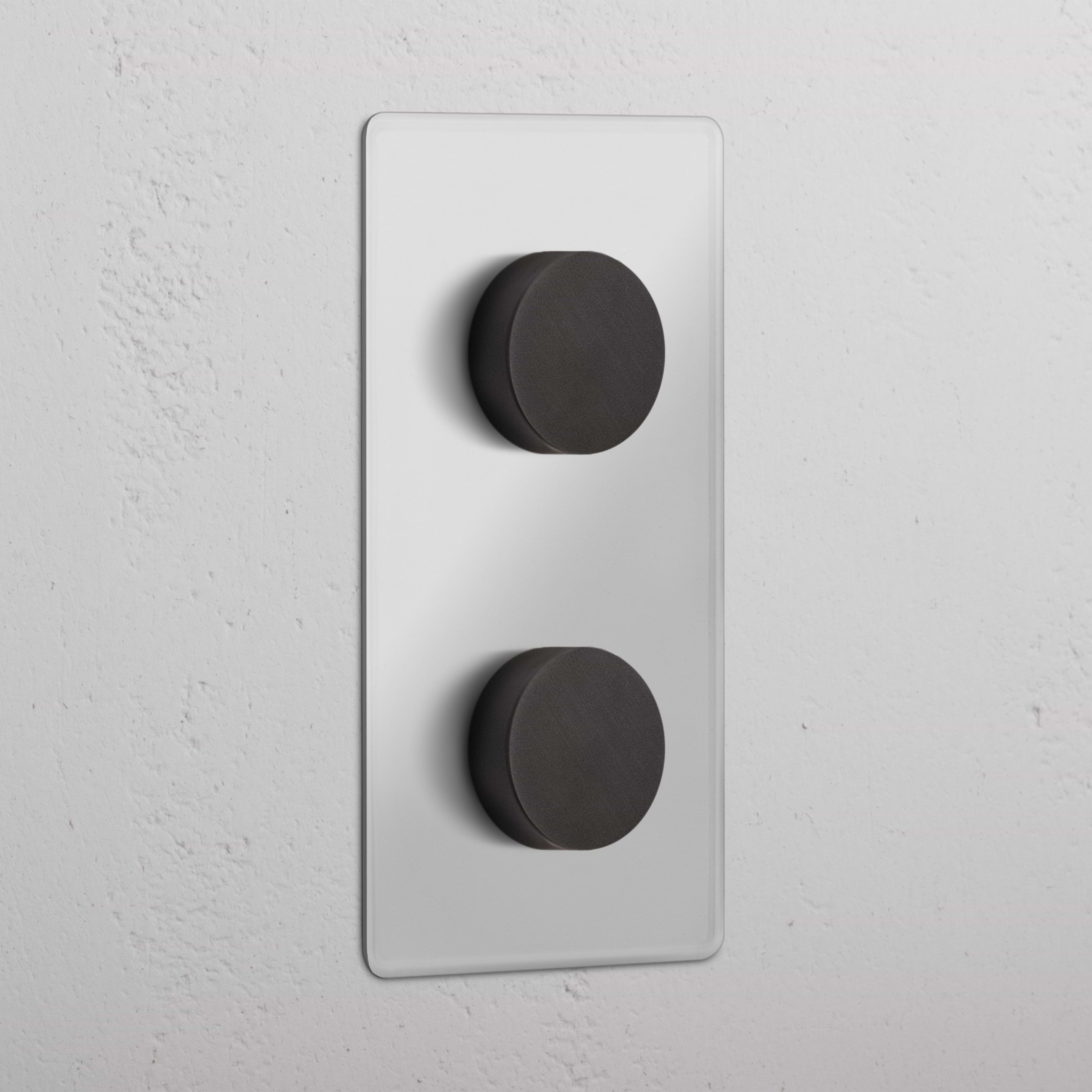 Double 2x Vertical Multiway Dimmer Switch in Clear Bronze with two round control knobs on a vertical plate.