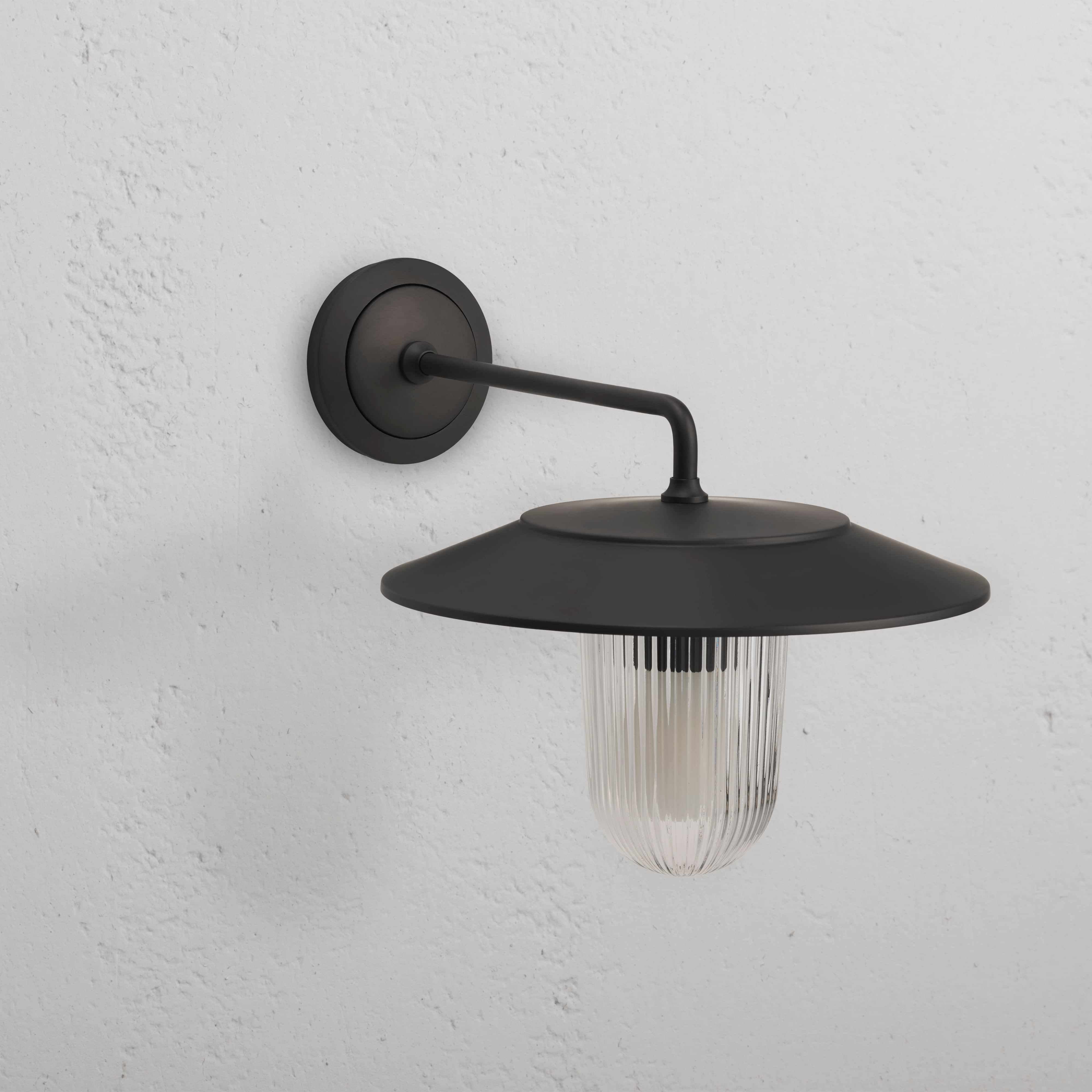Kensington Wall Light Fluted Glass – Bronze: medium wall light with ribbed glass shade and bronze finish.