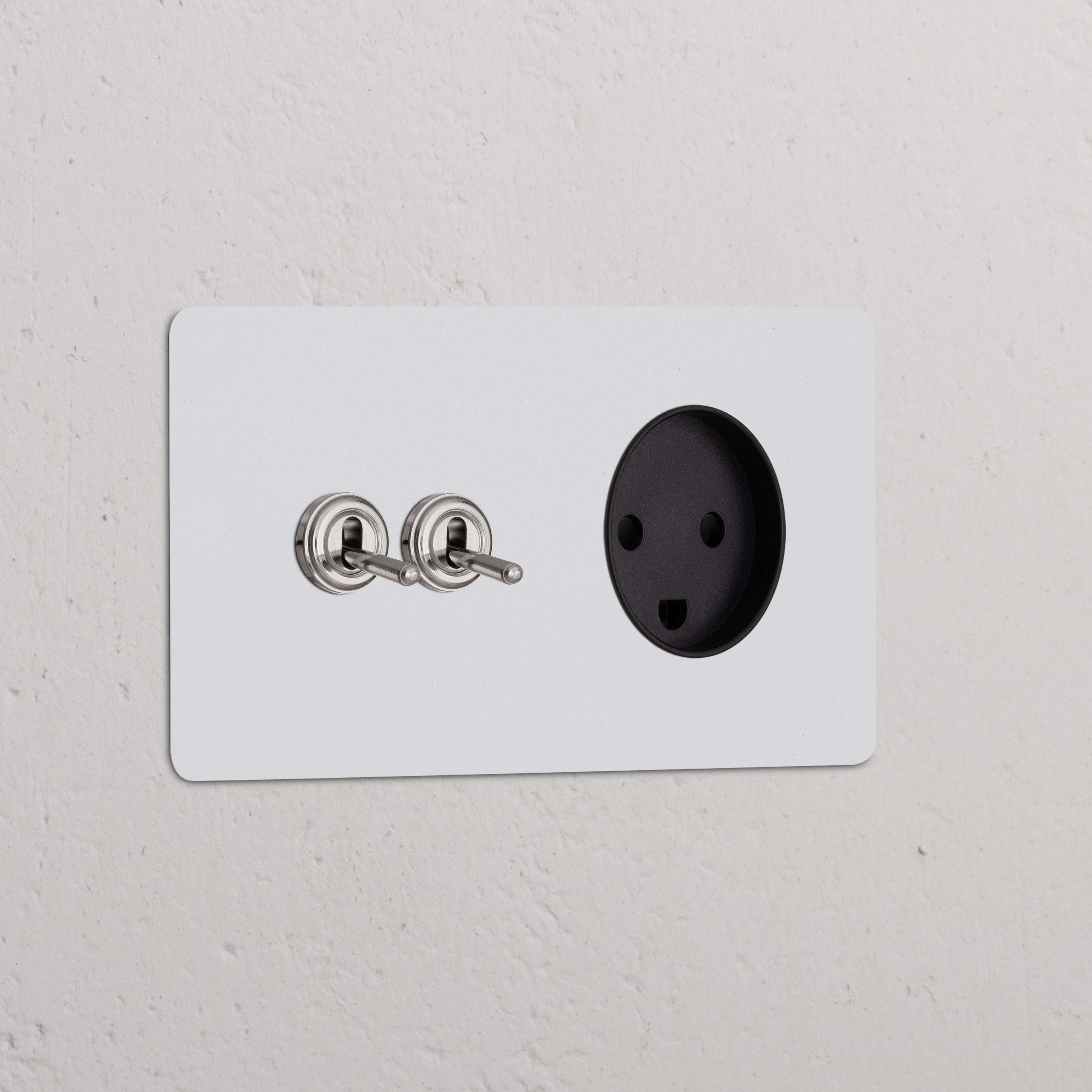 Double 2x toggle switch with Danish Type K power module in polished nickel black, for double sockets & modules.