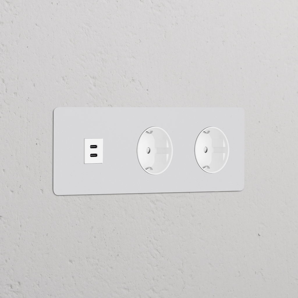 Paintable white power module with triple USB 30W and two Schuko Type F sockets, round design.
